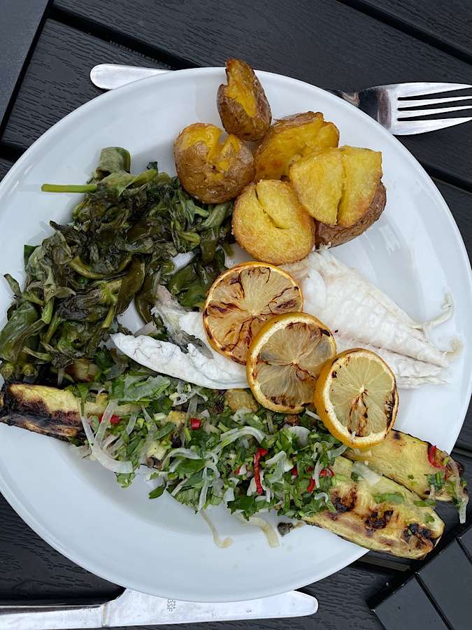 Plate with fish, potatoes, grilled zucchini